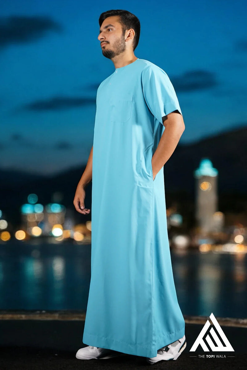 Adult Short Sleeves Thobe in Aqua Blue - TTW/D24 – A classic, comfortable, and elegant piece of Islamic attire, designed for both Jummah prayers and casual outings.
