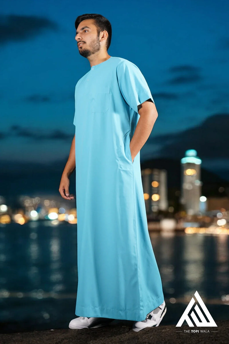Celebrate your faith in style with TheTopiWala’s Aqua Blue Short Sleeves Thobe – A modern jubbah that’s ideal for all occasions, from Eid celebrations to Islamic conferences.