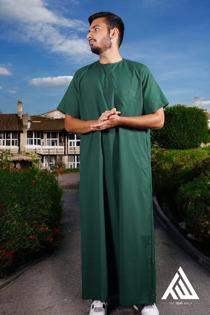 Elegant adult thobe/jubbah in dark green from TheTopiWala.com – Islamic clothing – Discover our collection of stylish and modest Islamic clothing, including premium thobes/jubbah and kufis/topi/prayer cap for men & kids, crafted with care for everyday and formal occasions.